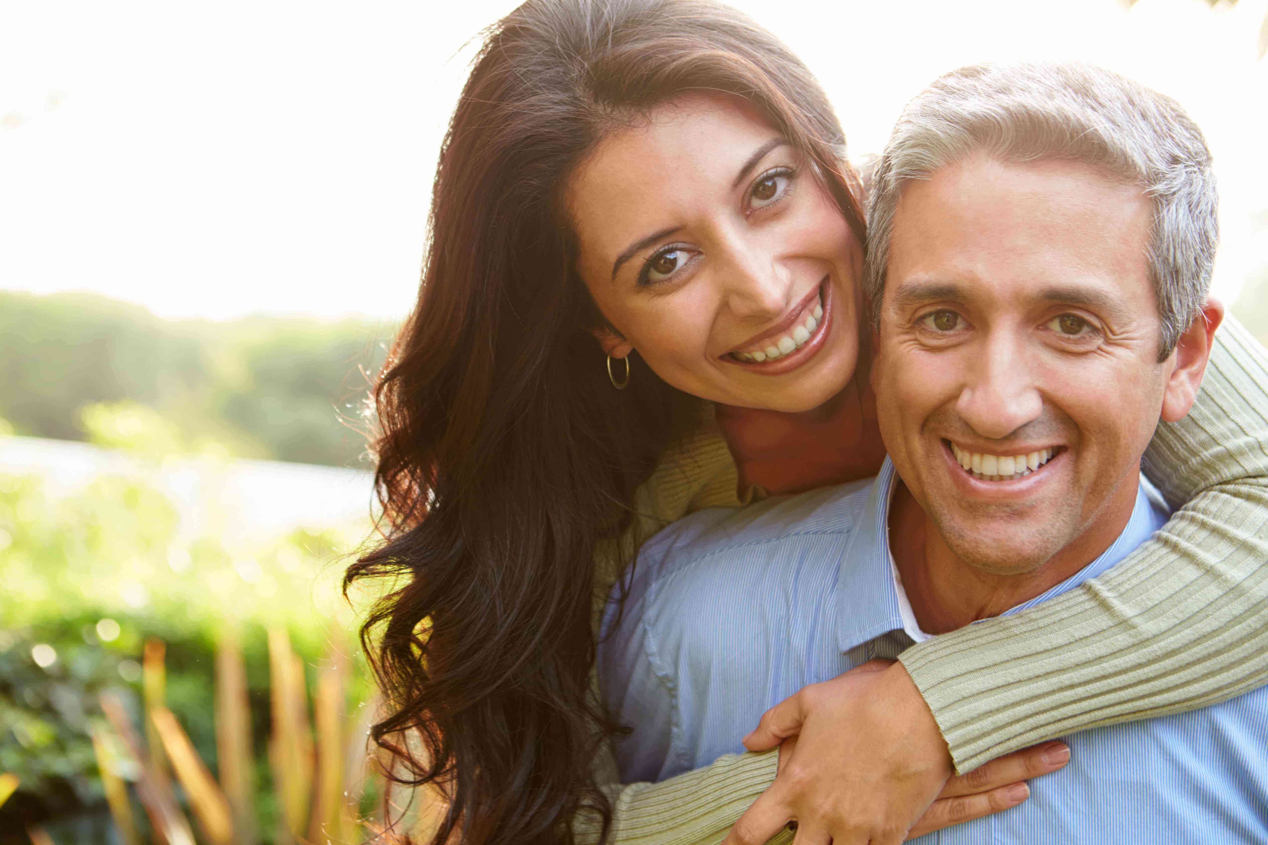 Couple laughing together outdoors